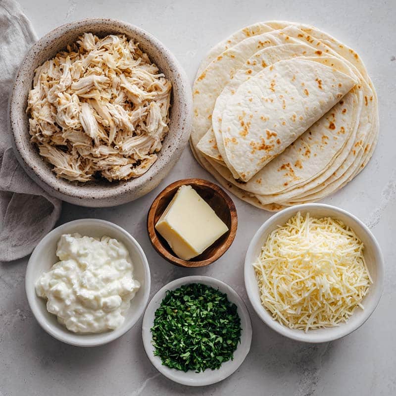 Cheesy garlic chicken wrap ingredients laid out