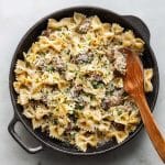creamy parmesan garlic beef bowtie pasta in skillet
