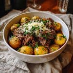 Crockpot Loaded Steak and Potato Bake with garnish