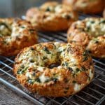 freshly baked cottage cheese spinach bagels on wire rack